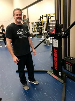 Man standing next to lift equipment