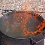 A lazy flame is allowed to heat things up for a couple hours before the pit (barrel) is covered and the ware allowed to soak up the carbon atmosphere and added elements inside. These elements are absorbed and transferred to the surface of the raw porous clay surface.