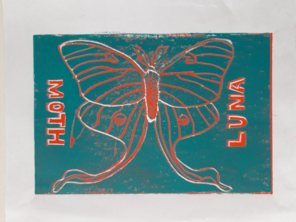 This piece is of a Luna moth, and the left side says Moth, and the right side says Luna.