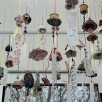 bells / furin hanging from the gallery cables