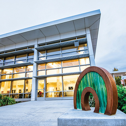 Building and sculpture on campus