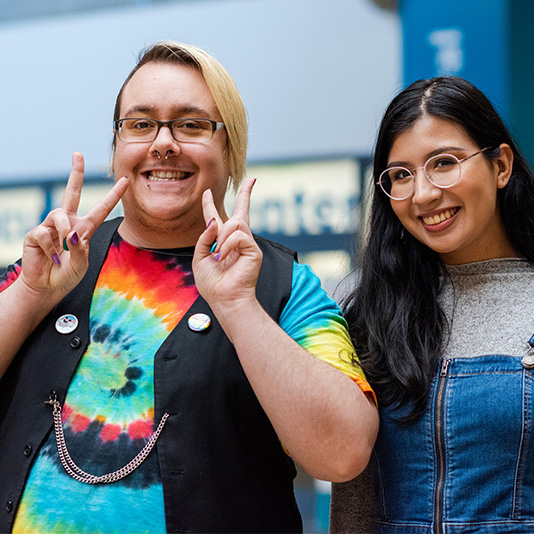 Two students dressed up for a pride event