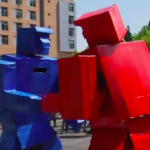 A green robot and a red robot facing off.