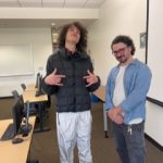 Alumnus and music industry professional James Hickey poses with a student during his class visit