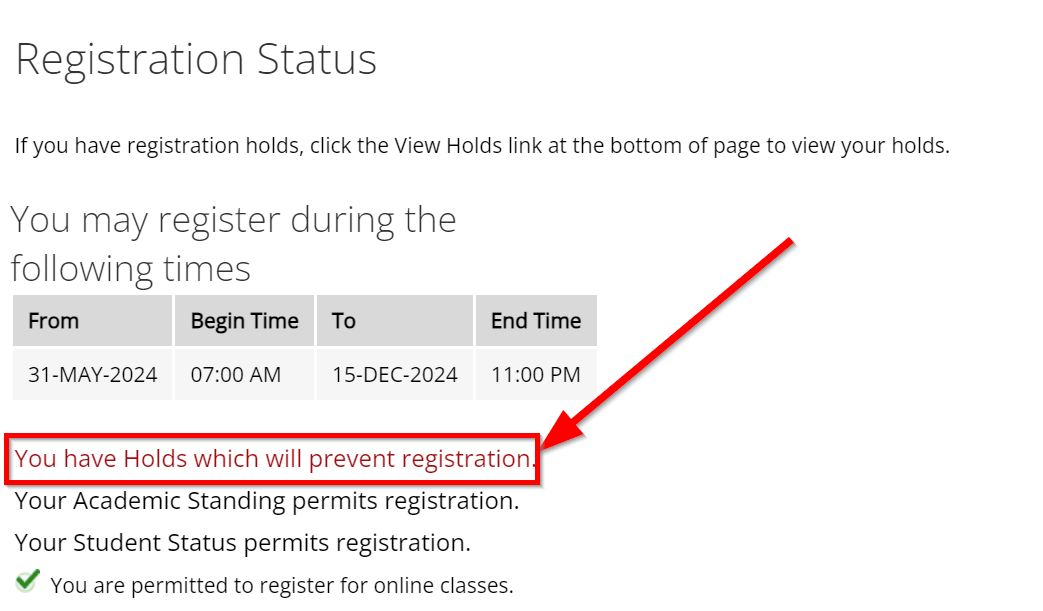 A red arrow pointing to text that reads "You have Holds which will prevent registration" on the registration status page.