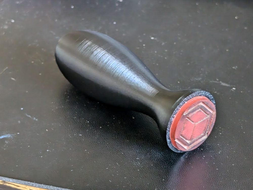 3D printed handle and laser cut rubber stamp