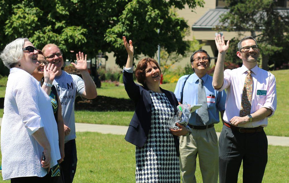 U.S. Rep. Suzanne Bonamici waves at Zippy the Drone with Rock Creek staff and Campus President Sandra Fowler-Hill (left). On the far right is Matthew Altman, Division Dean of Science & Technology at the campus.