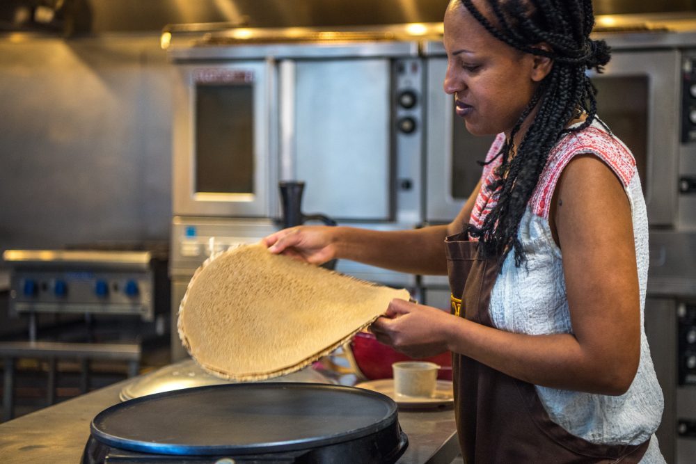 Photo of Eleni making Injera