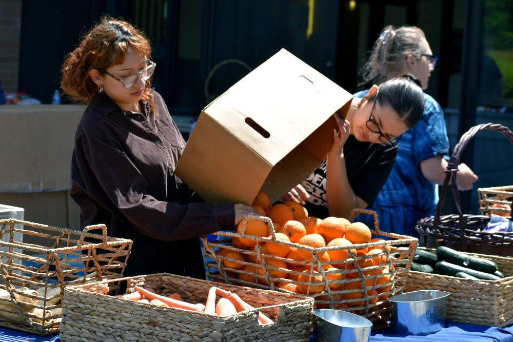 students unloading produce