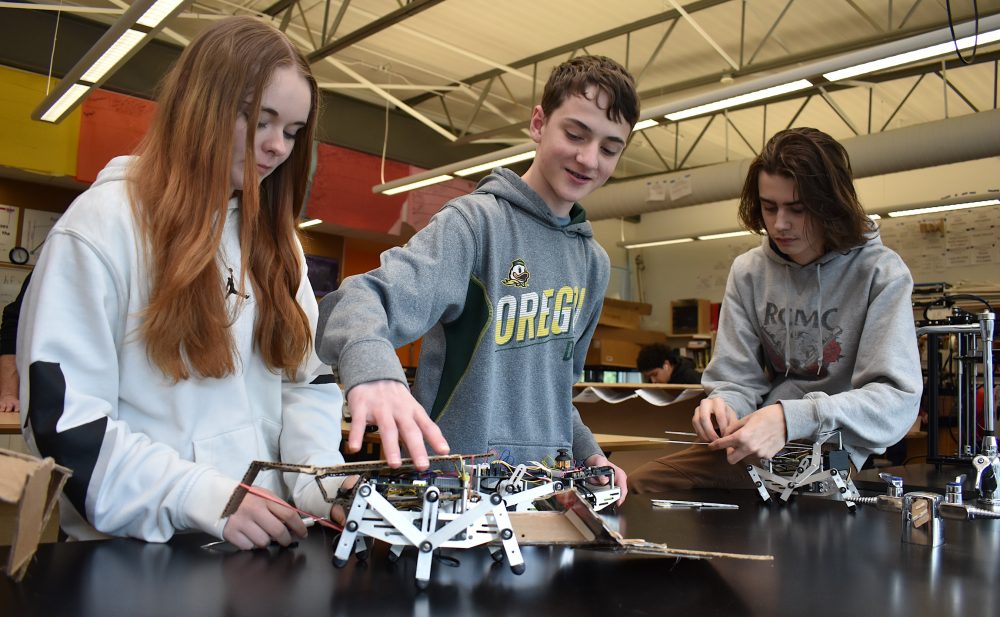 Forest Grove students working with robots