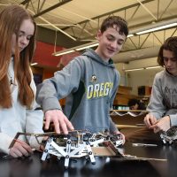 Forest Grove students working with robots