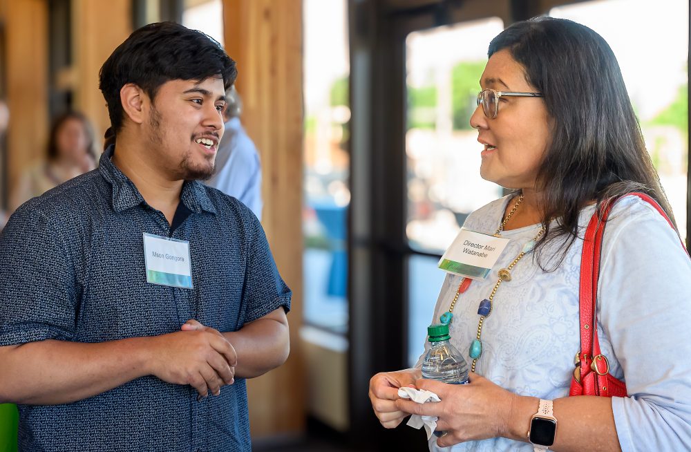 Mson Gongora chats with PCC Board Trustee Mari Watanabe.