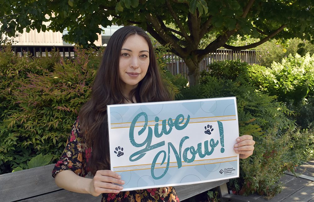 Gina with sign