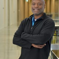 Prentice Davis in hallway, leaning