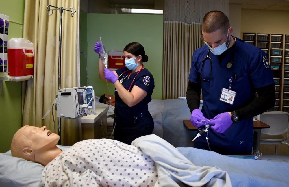 Alena Hasson and Chris Immonen in nursing lab