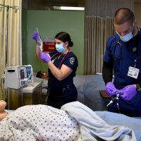 Alena Hasson and Chris Immonen in nursing lab