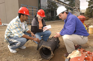 Students observe a work site with instructor Todd Sanders