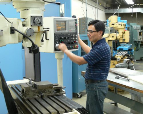 Man using CNC machine