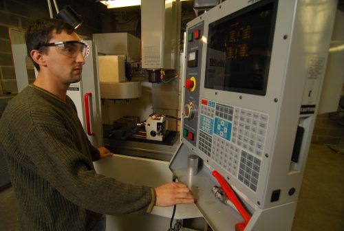 Man using CNC machine