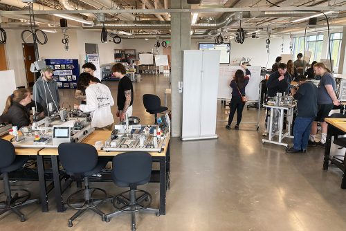 Students working in the Opportunity Center workspace