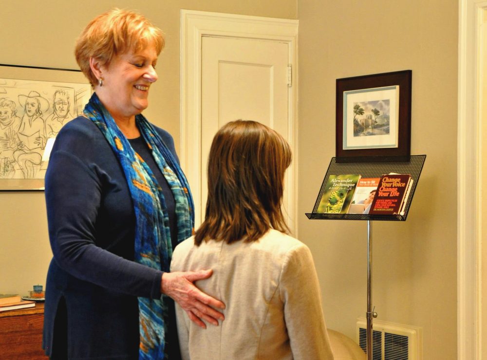 Woman teaches breathing exercises to student at business Breath is the Answer