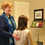 Woman teaches breathing exercises to student at business Breath is the Answer