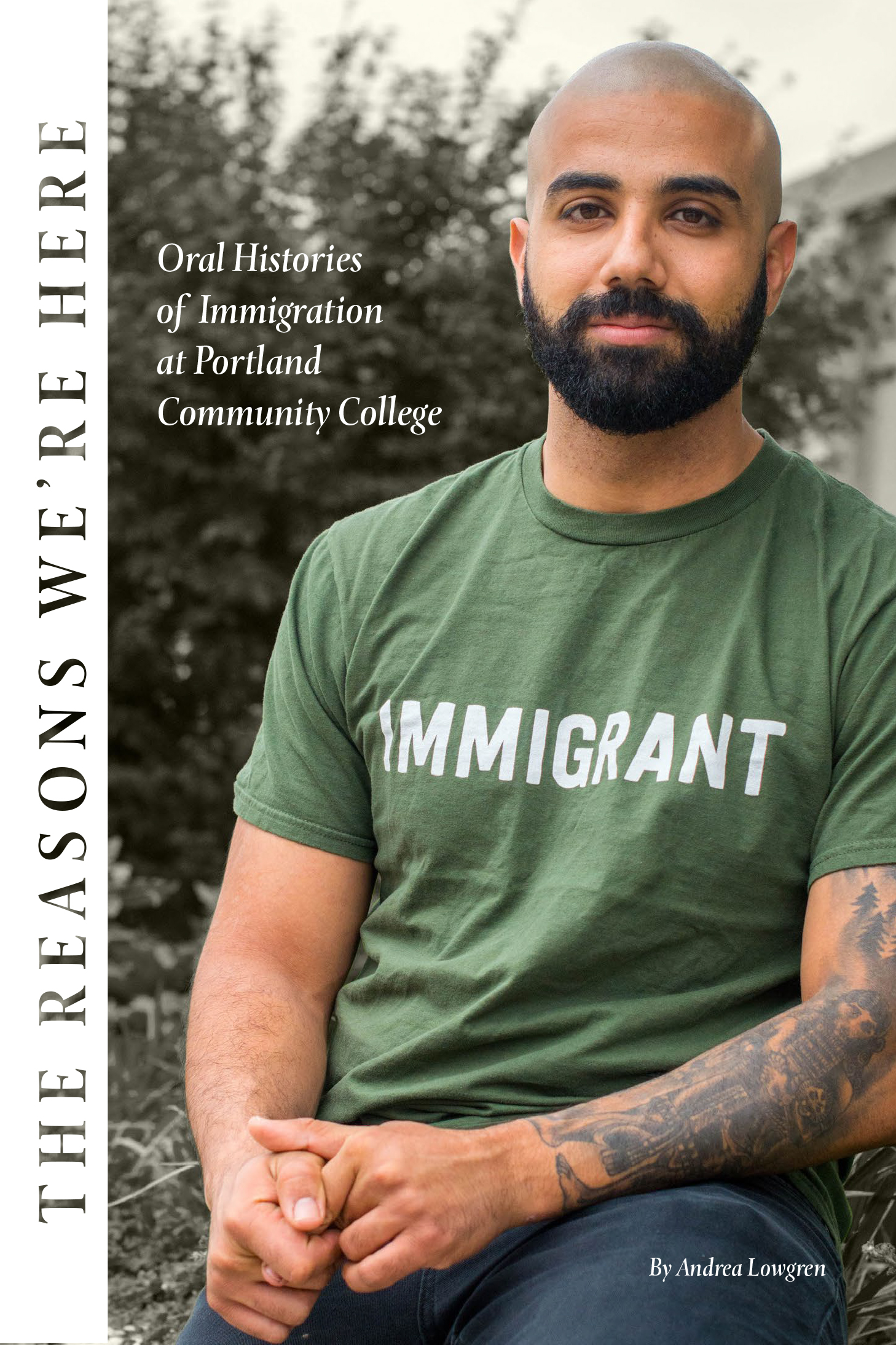 Cover of ebook The Reasons We're Here, featuring man wearing t-shirt that reads "immigrant"