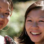 Two women smiling outside