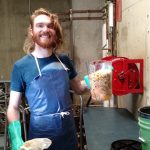 Student holding compost