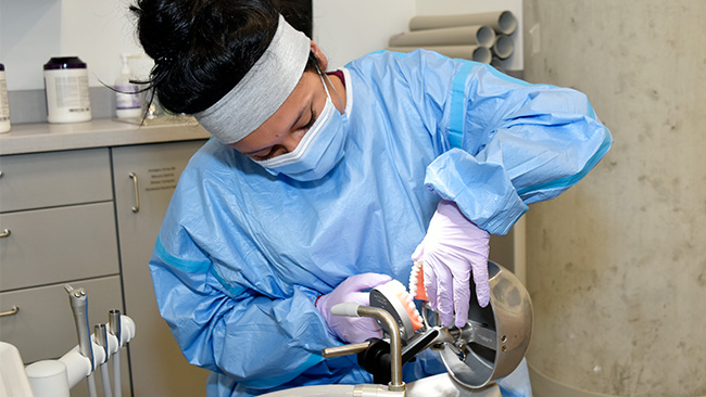 Student in a dental hygiene class